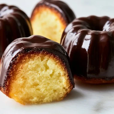 Delicious Canelé caramelized custard cakes on a elegant plate