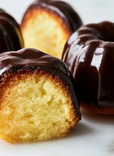 Delicious Canelé caramelized custard cakes on a elegant plate