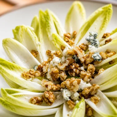 Quick French Endive Salad Recipe with Walnuts and blue cheese served in a bowl.
