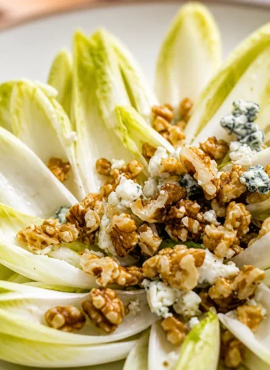 Quick French Endive Salad Recipe with Walnuts and blue cheese served in a bowl.
