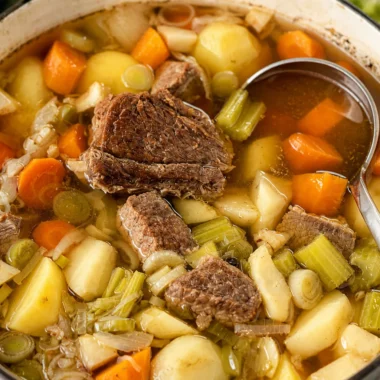 Classic French Pot-au-Feu: a traditional beef and vegetable stew simmering in a large pot.