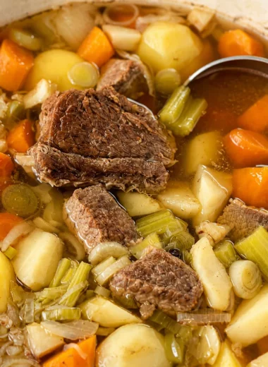 Classic French Pot-au-Feu: a traditional beef and vegetable stew simmering in a large pot.