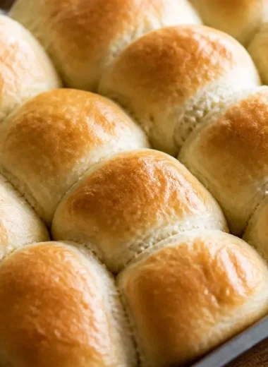 Easy 30-minute dinner rolls fresh out of the oven, golden brown and fluffy.
